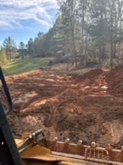 Skid steer land clearing project on slope — C4 Landscaping