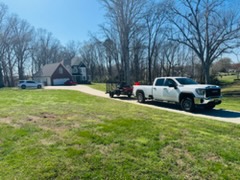 C4 Landscaping crew truck and trailer arriving at a residential property — HOA scheduled visit