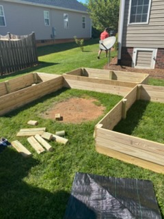 Building raised wooden garden beds in progress — C4 Landscaping