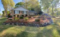 Retaining Walls — stacked stone wall along curved landscape bed